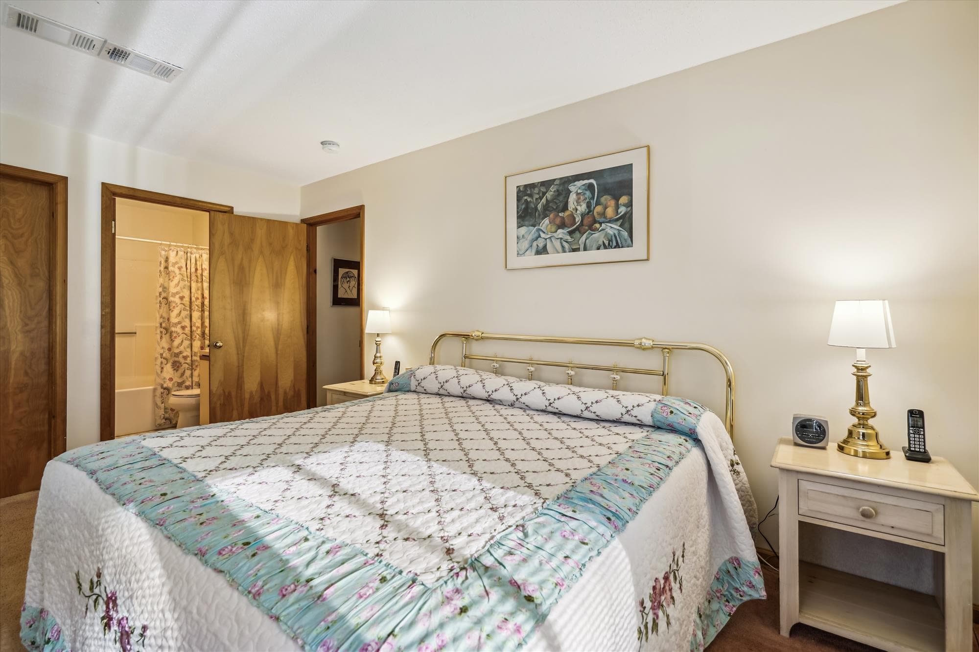 This bedroom has a full bath with a whirlpool tub.