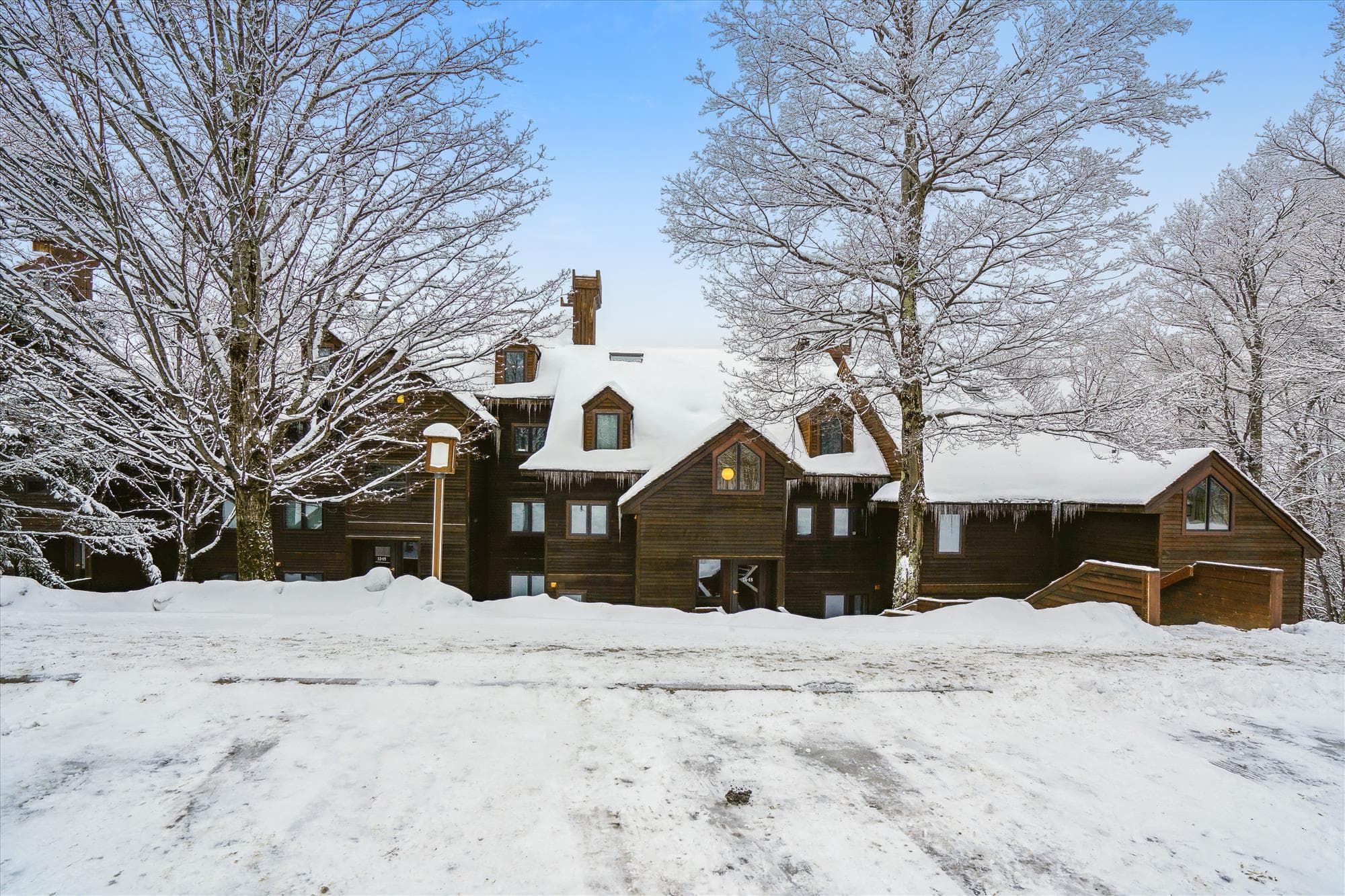 Classic alpine-style architecture surrounded by peaceful mountain scenery in the Highridge community.