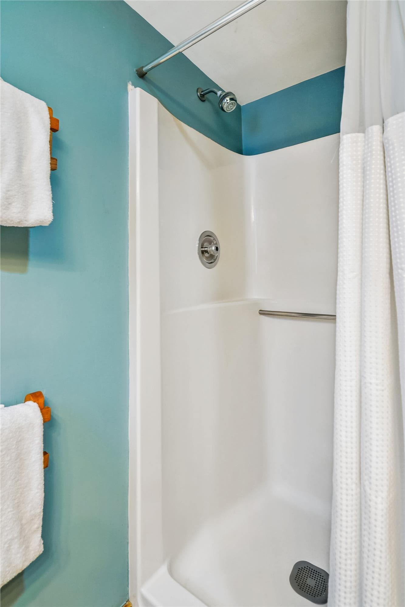 Walk-in shower located in the full bathroom.