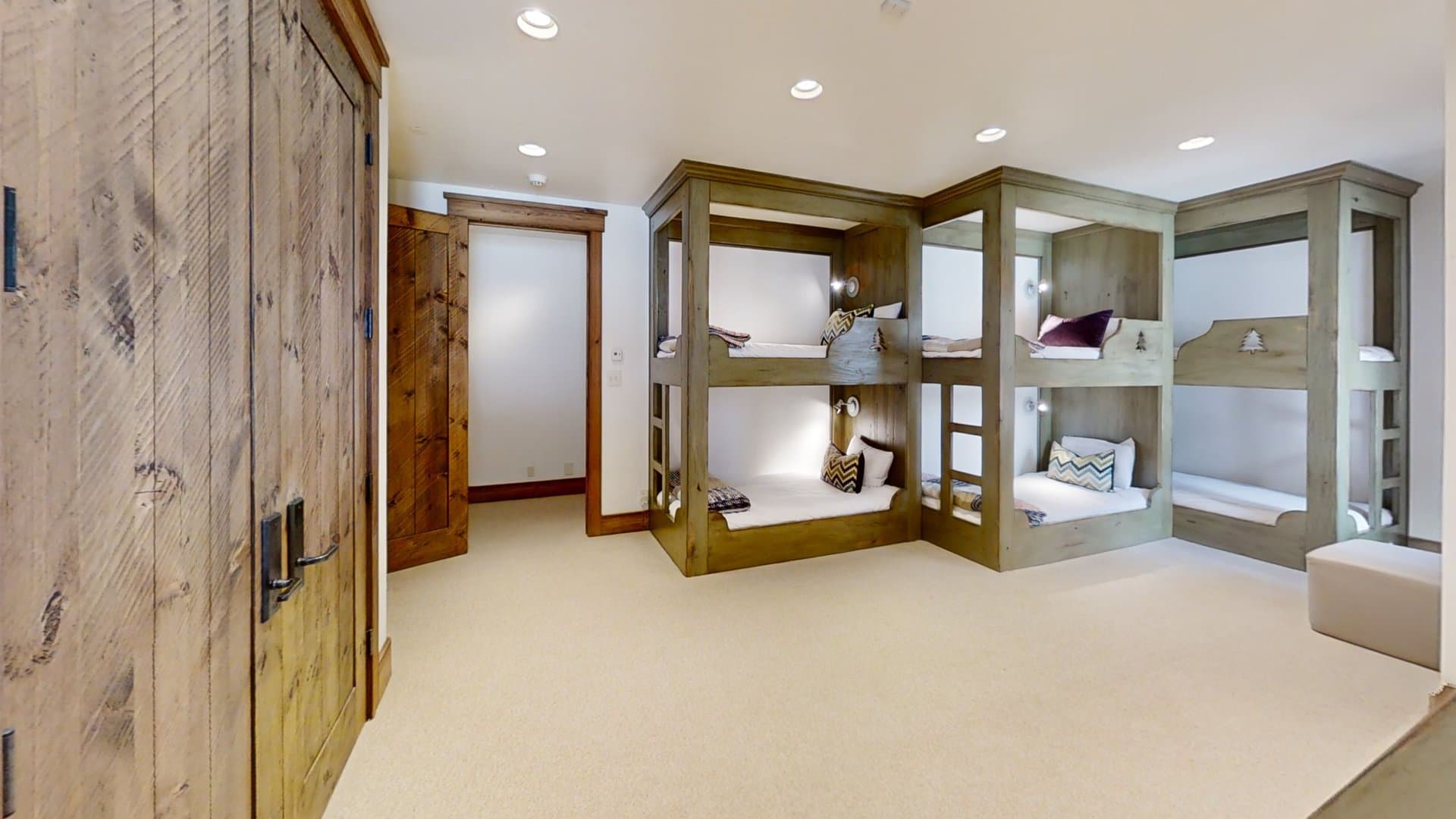 Bunk beds line the wall of the bunkroom.