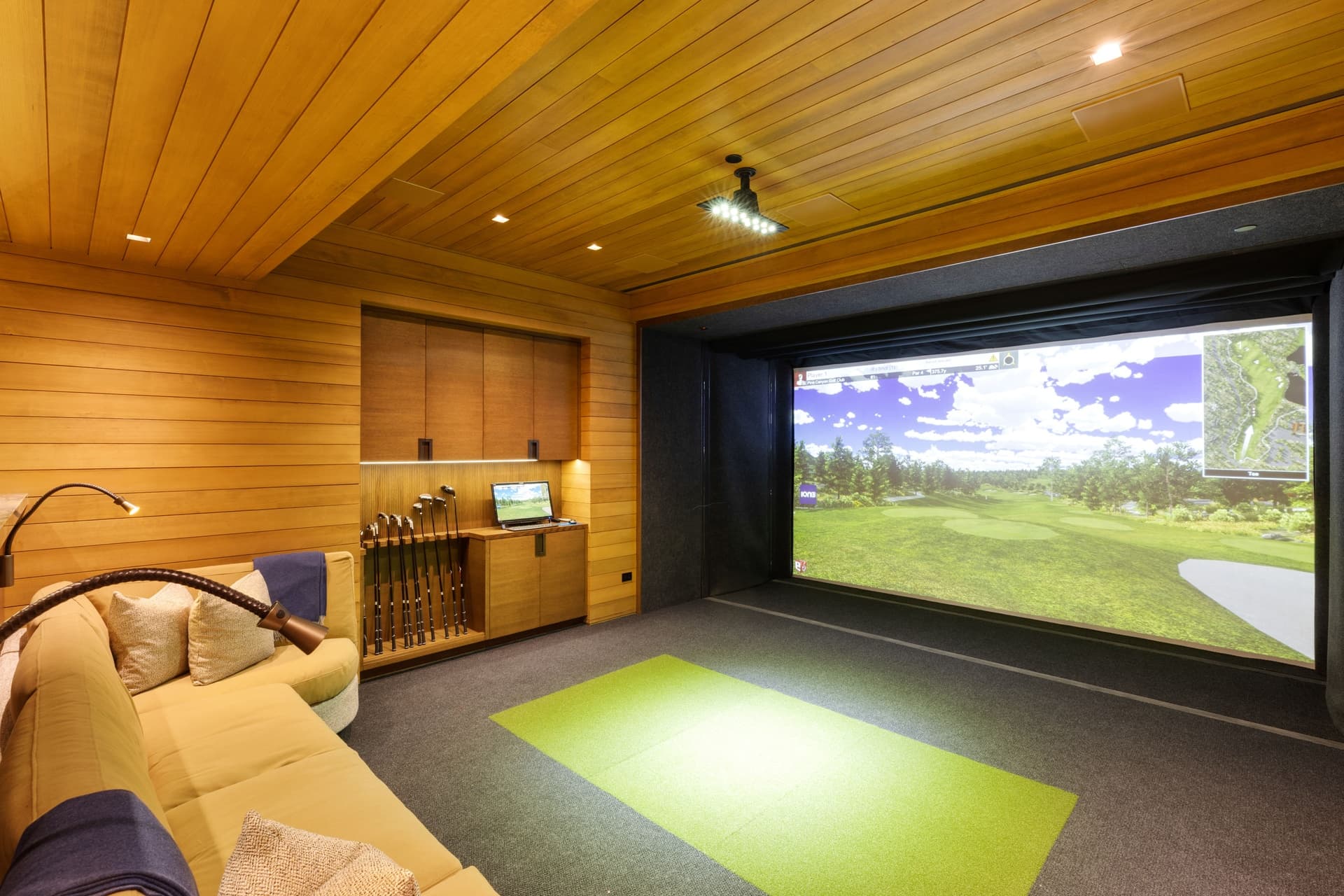 Indoor Golf Simulator Room With Seating.