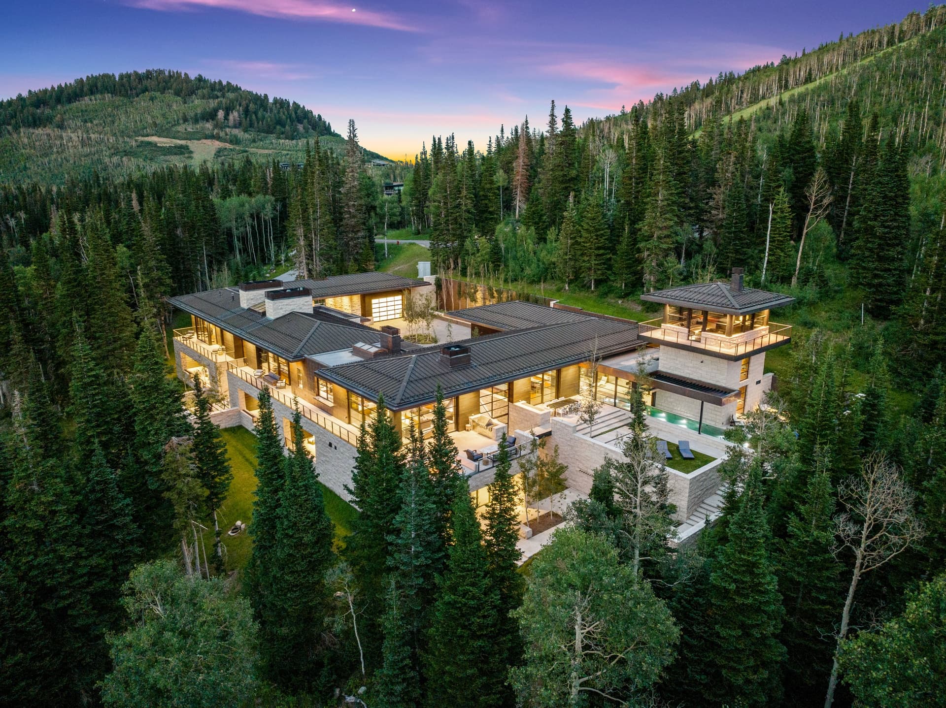 Aerial View Of Property at Sunset.