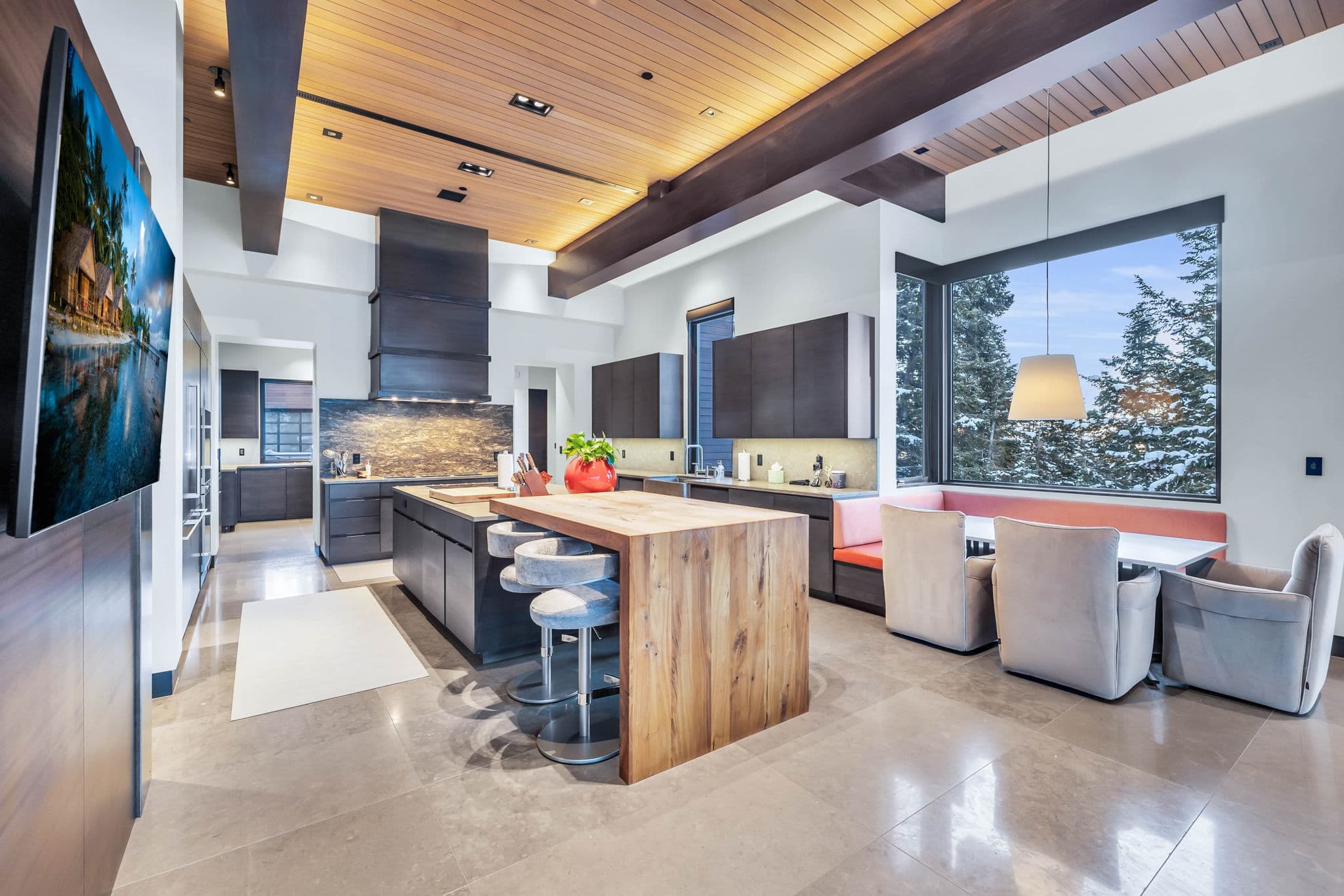A modernkitchen with sleek finishes and mountain views.