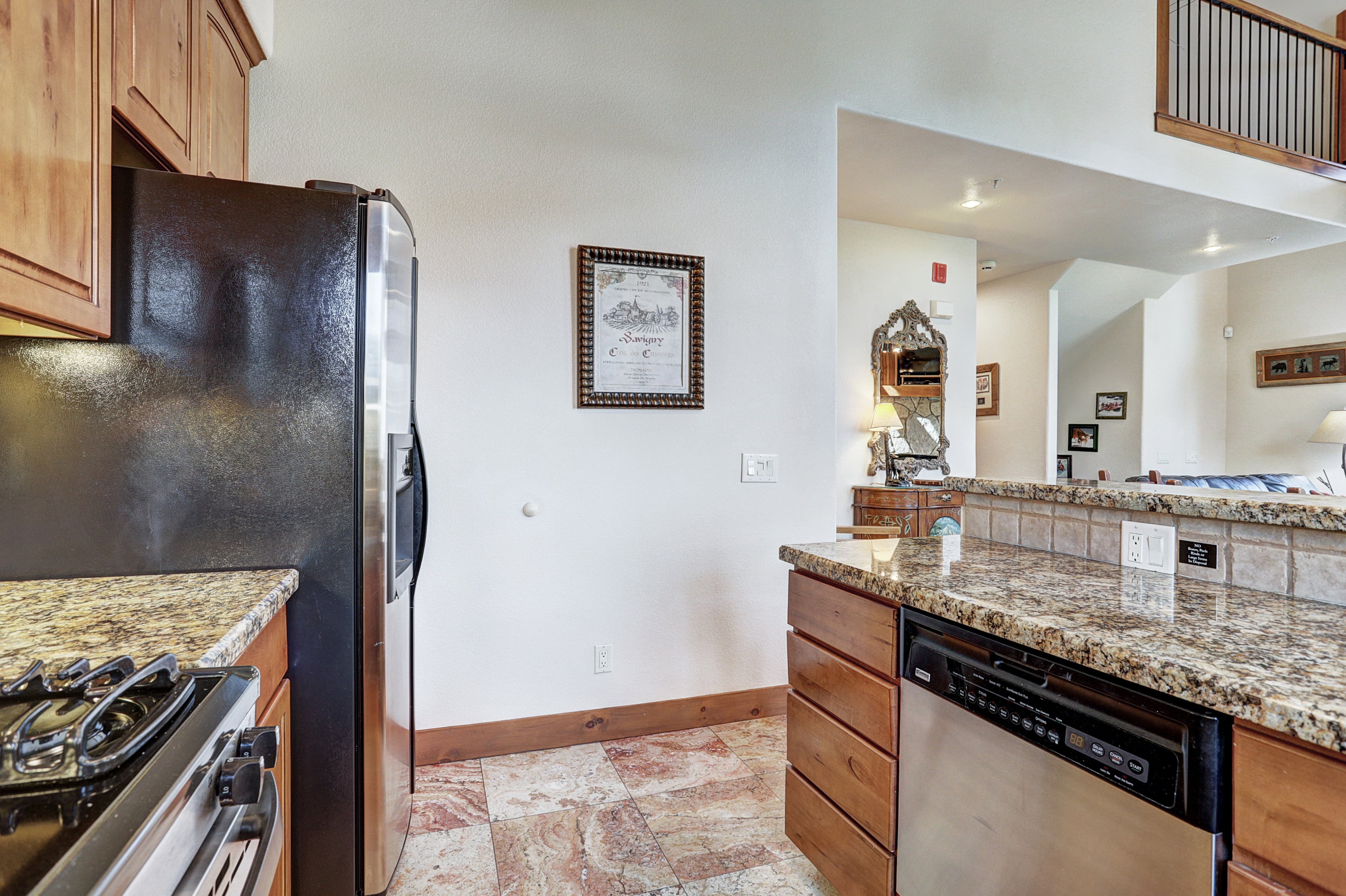 Store all of the food and stacks you need in this large stainless steel fridge - Amber Sky Breckenridge Vacation Rental