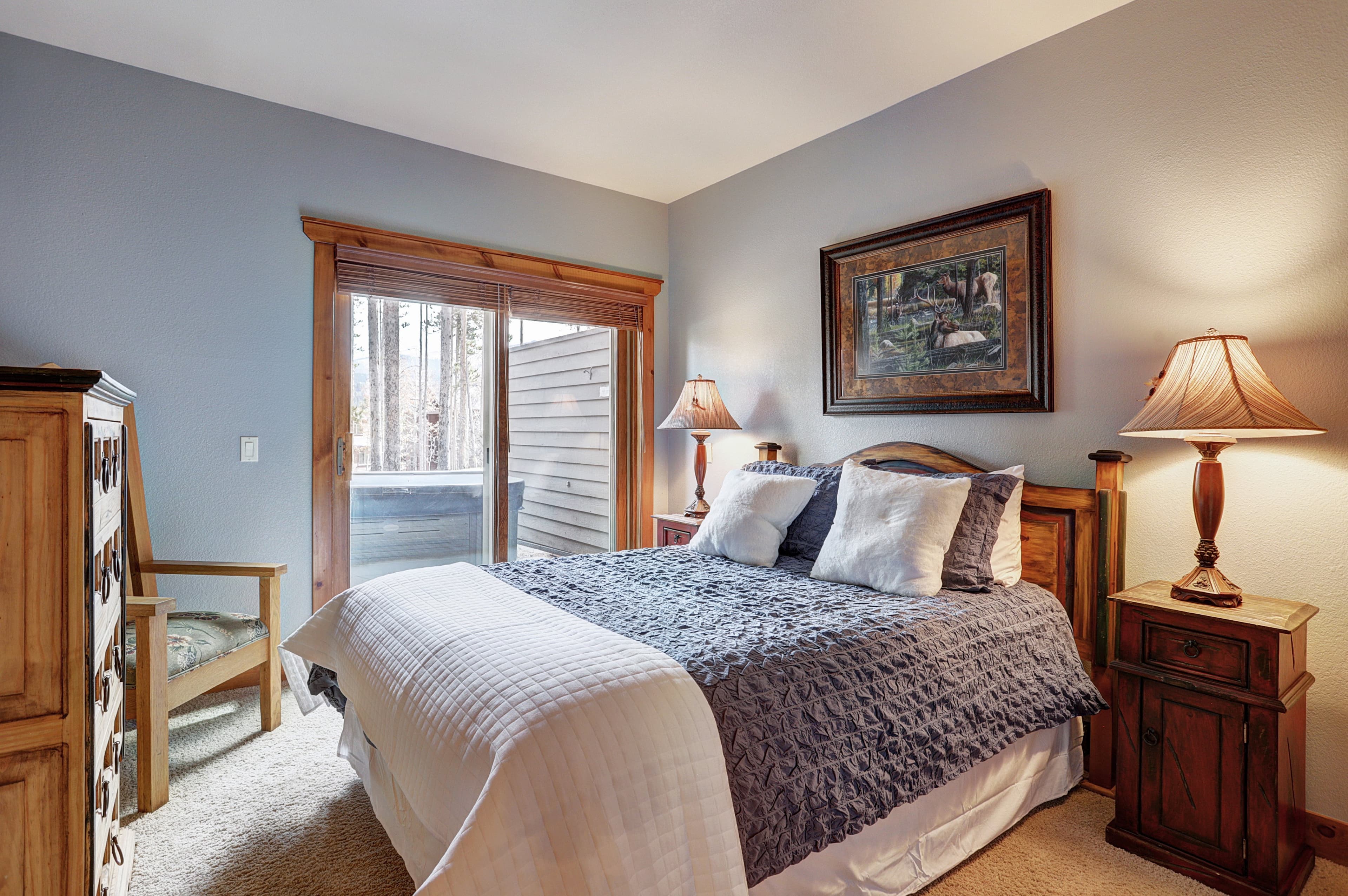 Second queen bedroom with private balcony that offers lots of natural light and secluded outdoor space, and access to the hot tub  - Amber Sky Breckenridge Vacation Rental