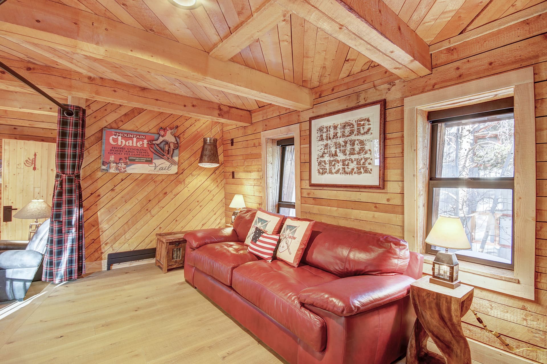 Upper level family room showing sleeper sofa with privacy curtain - Arrow Darrow Breckenridge Vacation Rental