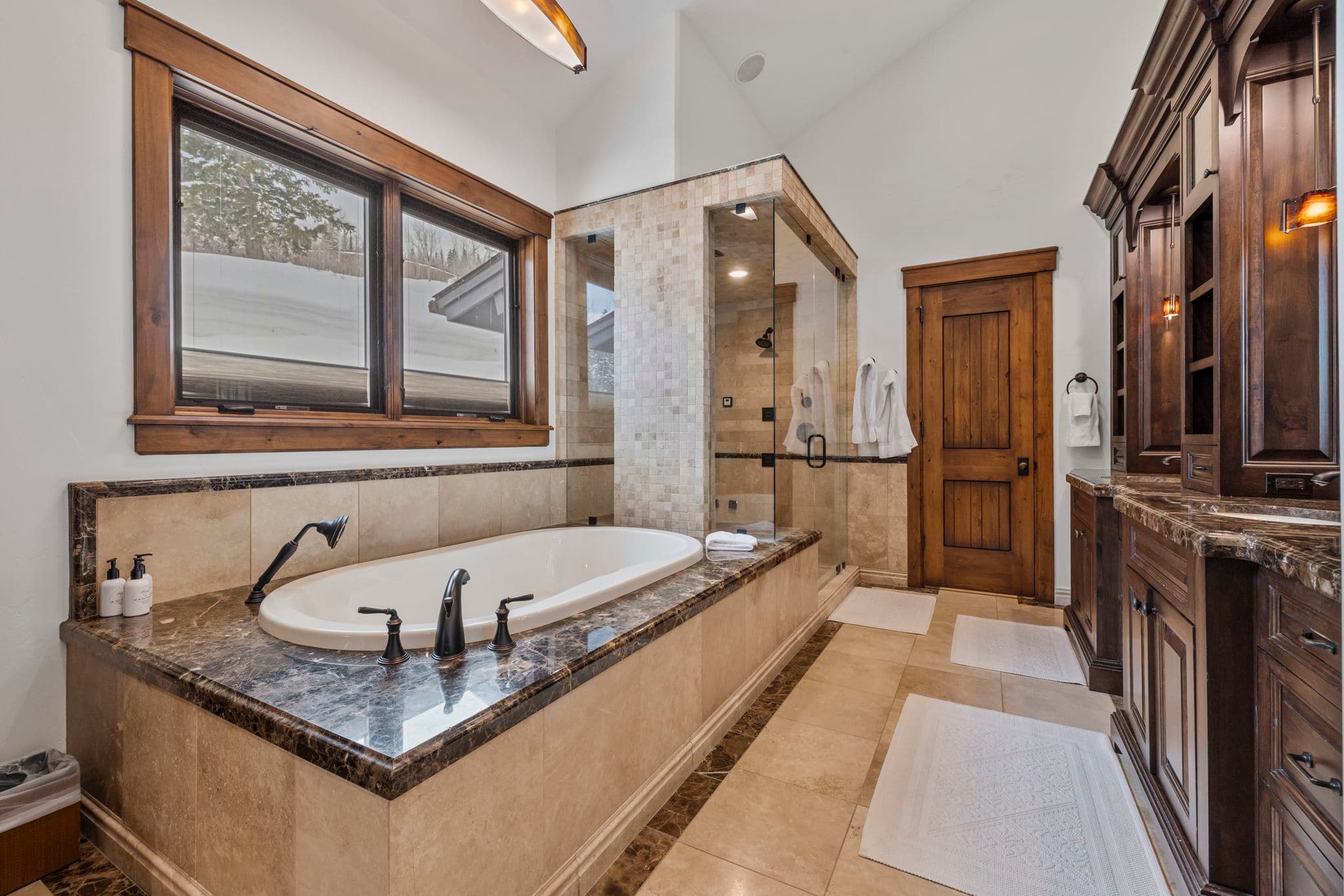 the primary bathroom with large soaking tub and shower