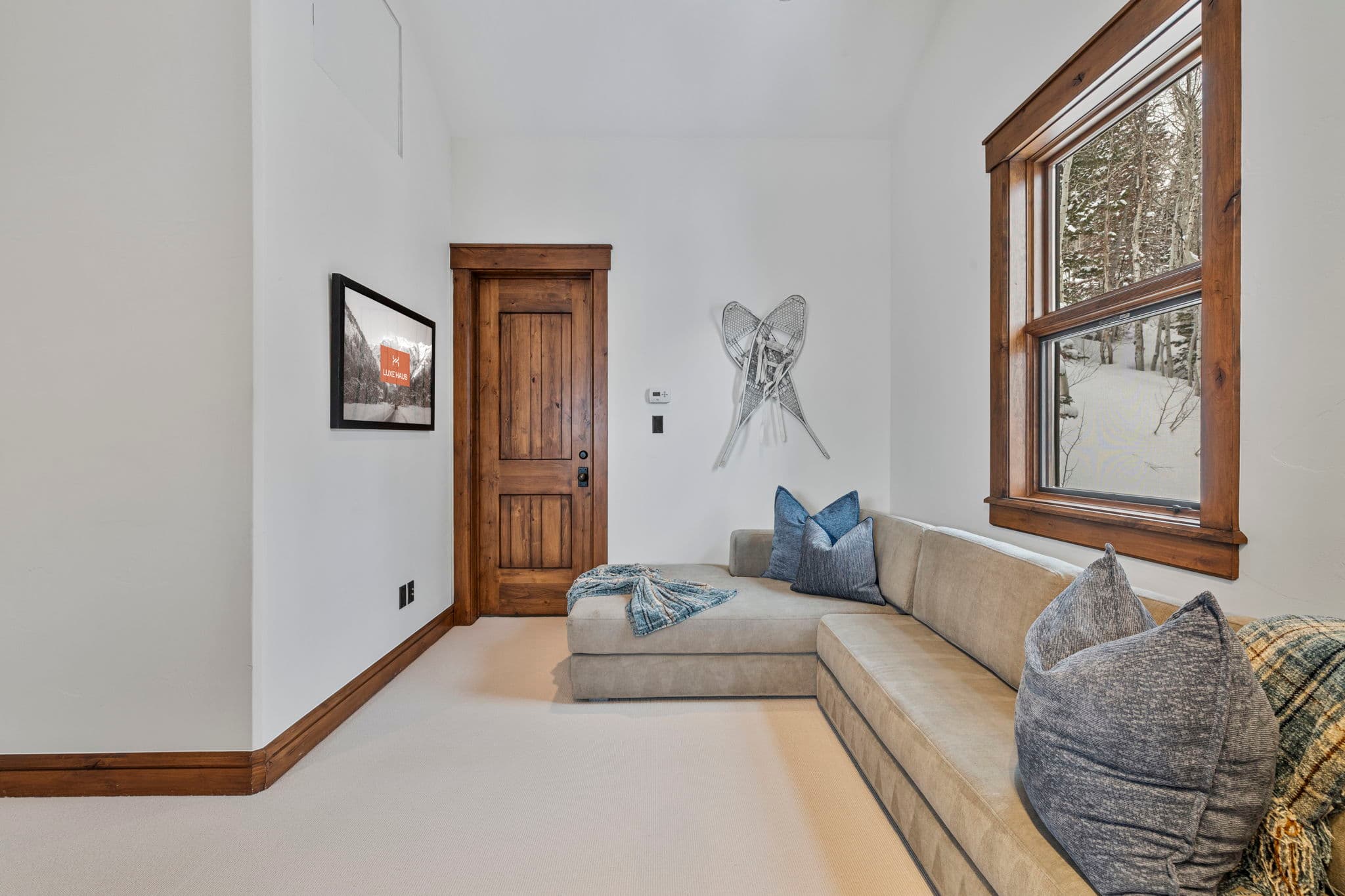 a lounge area with large l-shaped couch
