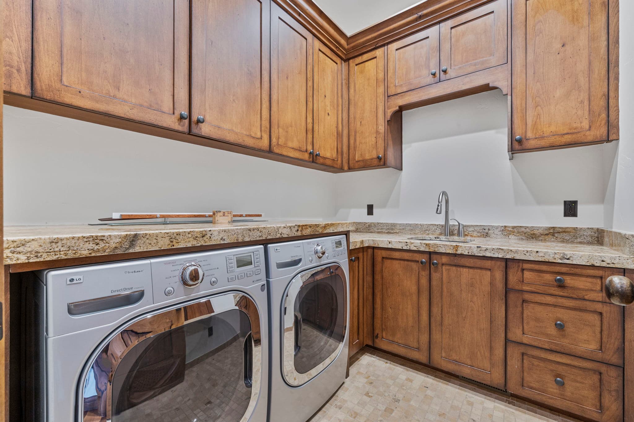 laundry room with sink and lots of storage