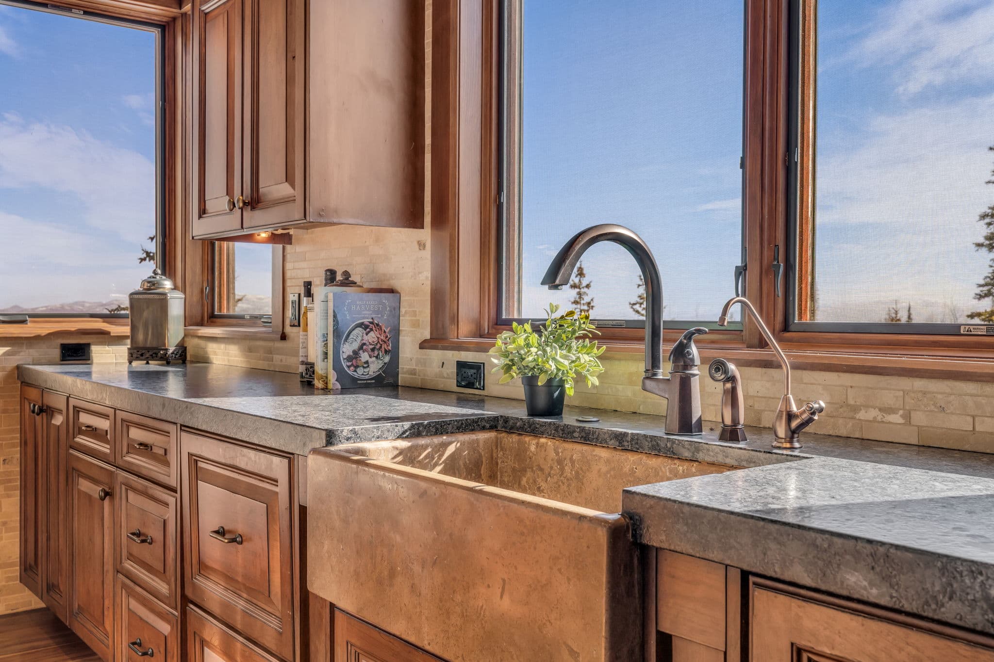 view of large sink with windows and mountain views