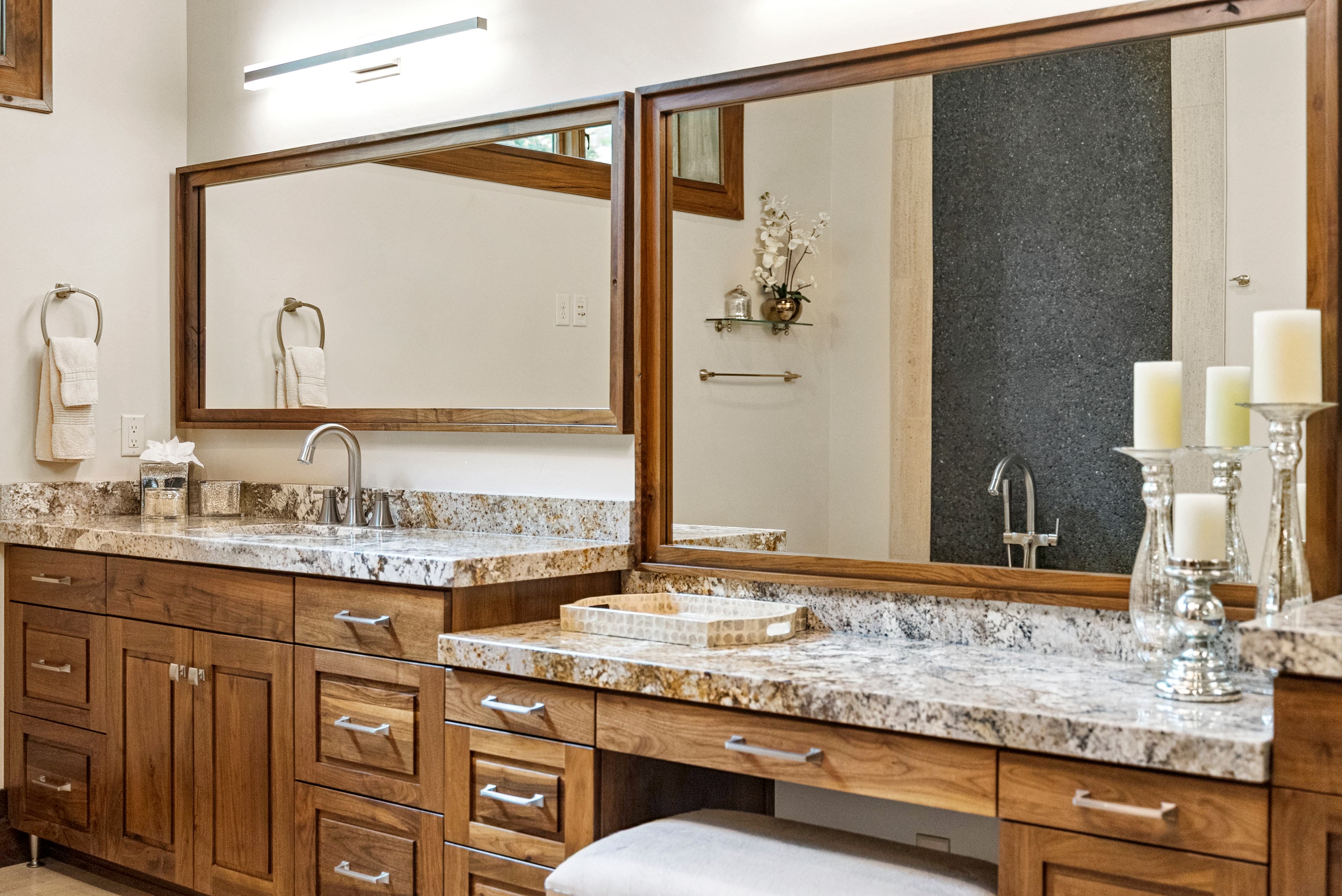 luxury bathroom with large mirror and dual sink vaniites