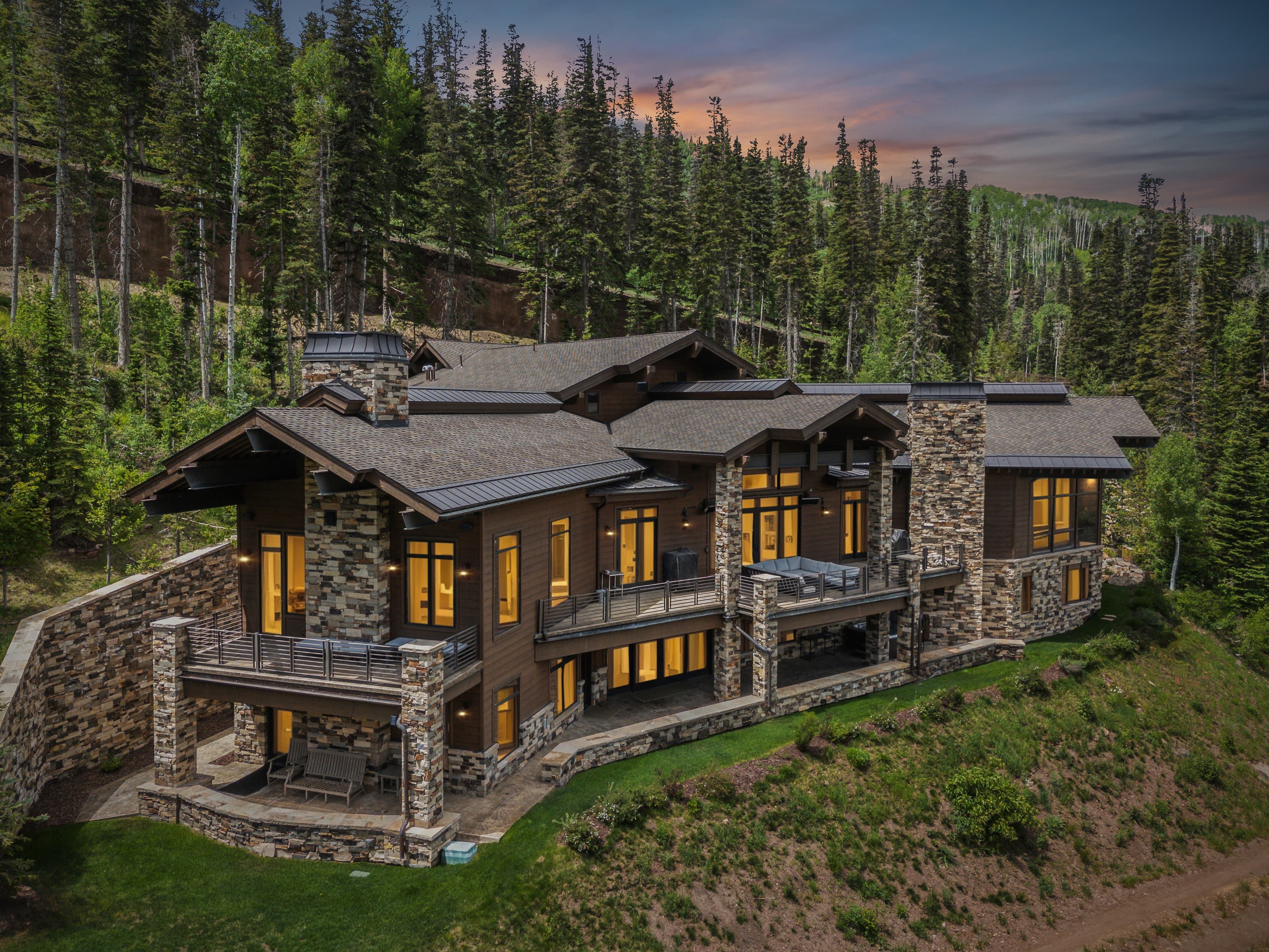 grandview perched alongside a ski run with the sunset and mountains behind it
